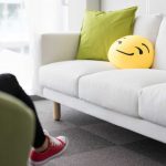 Colorful and Funny Pillows on Sofa in Modern Startup Office