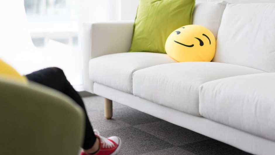 Colorful and Funny Pillows on Sofa in Modern Startup Office