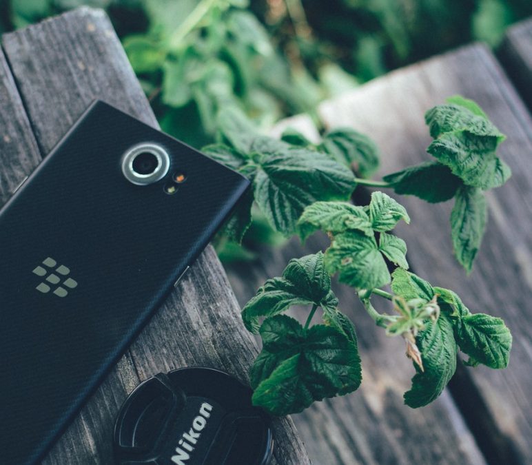 Black Blackberry Priv with Nikon Lens Cover